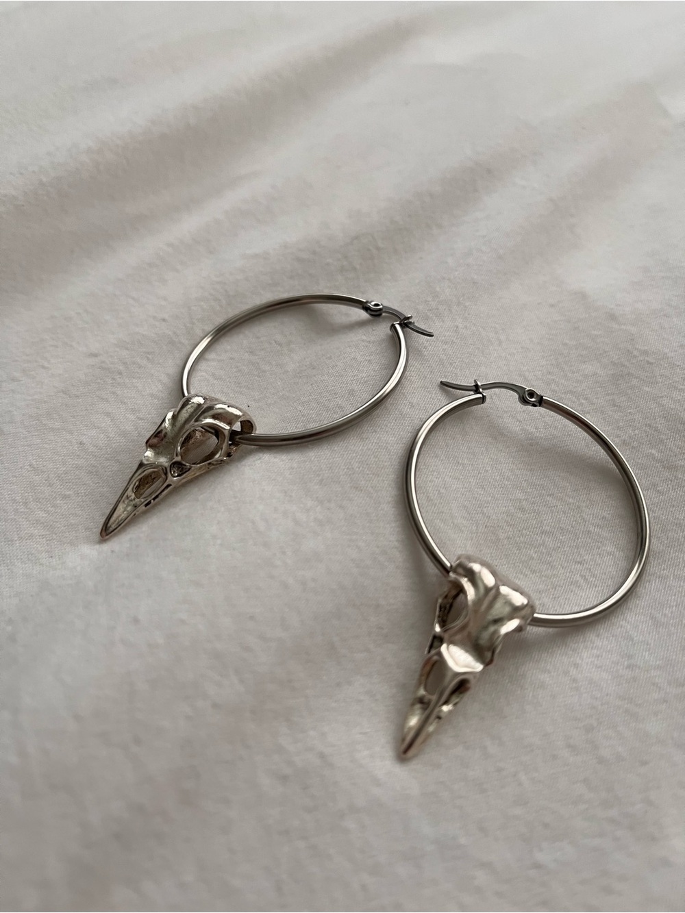 Stainless steel silver hoops and alloy bird skull dangle earrings